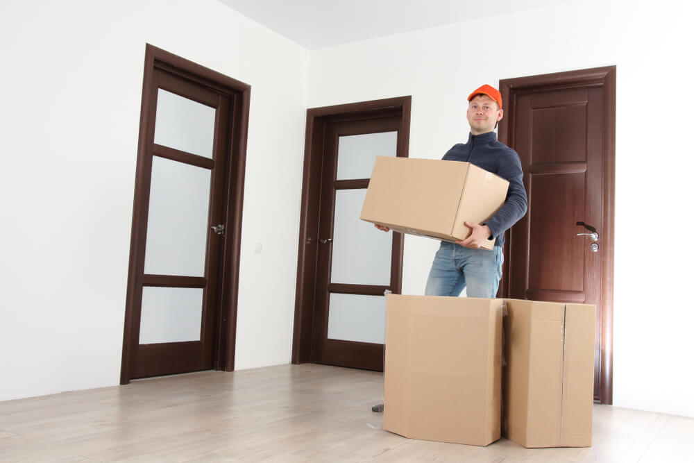 Moving team assisting with large furniture in Hollister FL